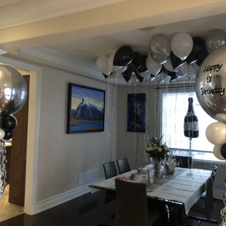 custom balloon orbz with tassels champange bottle and ceiling balloons
