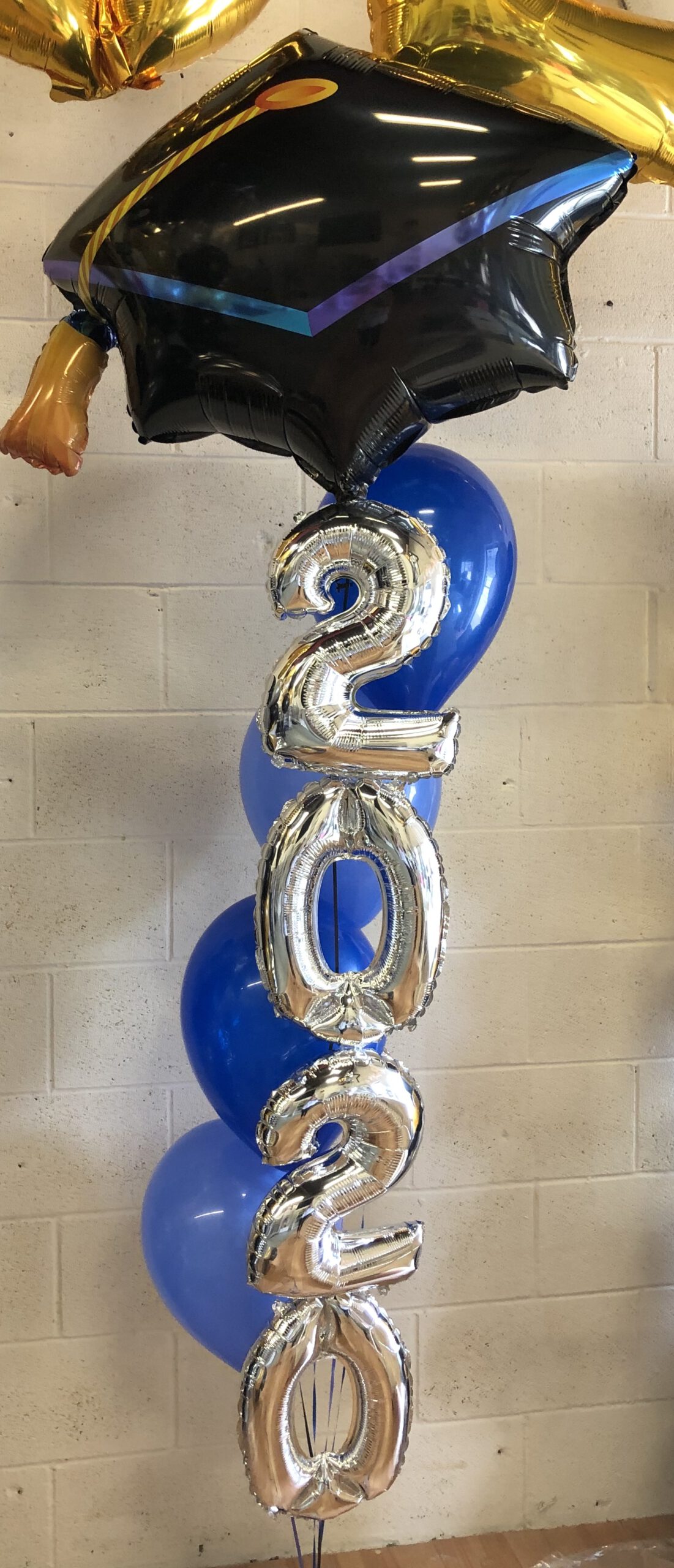 Grad cap with year helium